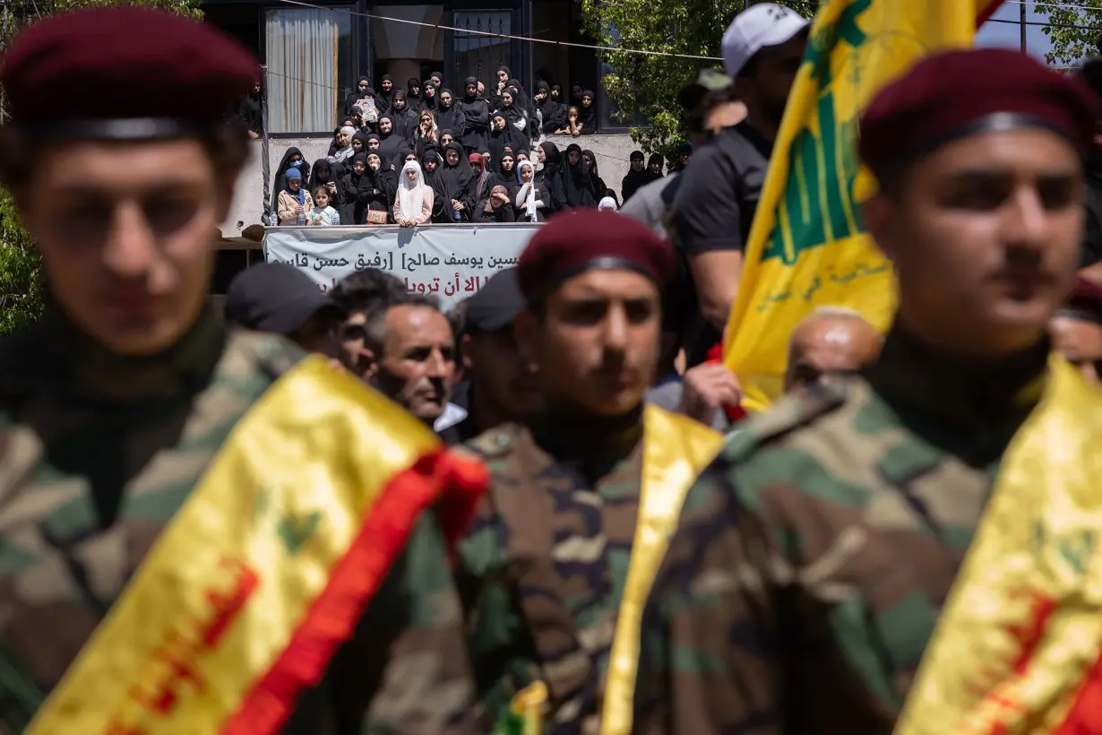 Women attend the funeral of Hezbollah fighters Abbas Ahmad Srour and Mohammad Hussein Kassem in Aita al Chaab, Lebanon on June 29.