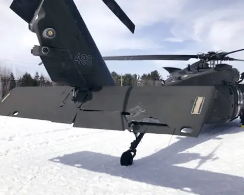 A snowmobiler who crashed into a parked Black Hawk helicopter is awarded $3 million