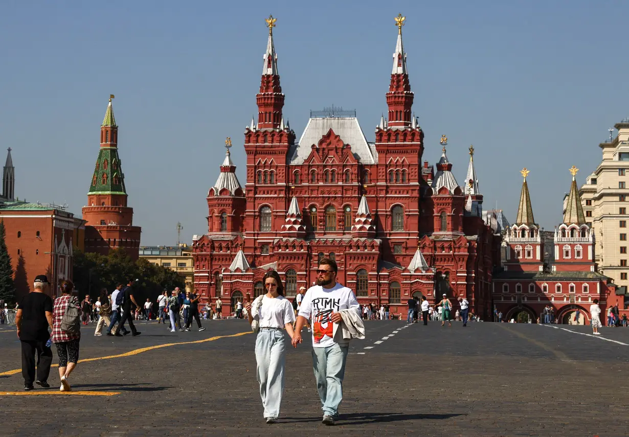 People walk in Red Square in Moscow