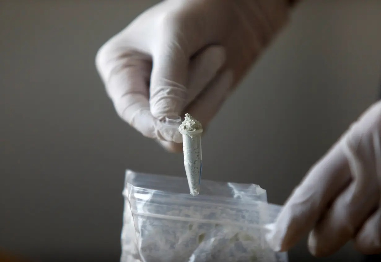 Reuters journalist Stephen Eisenhammer displays fentanyl precursors at Reuters' office, in Mexico City