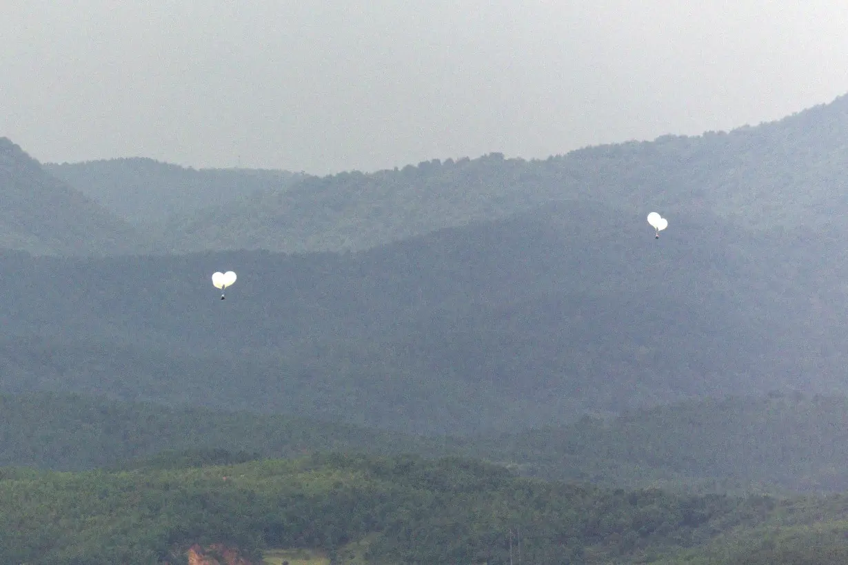 Balloons believed to have been sent by North Korea, fly over a North Korean territory in this picture taken from an observation post near the demilitarized zone separating the two Koreas, in Paju