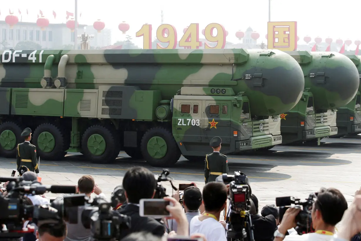 FILE PHOTO: Military vehicles carrying DF-41 intercontinental ballistic missiles travel past Tiananmen Square during the military parade marking the 70th founding anniversary of People's Republic of China