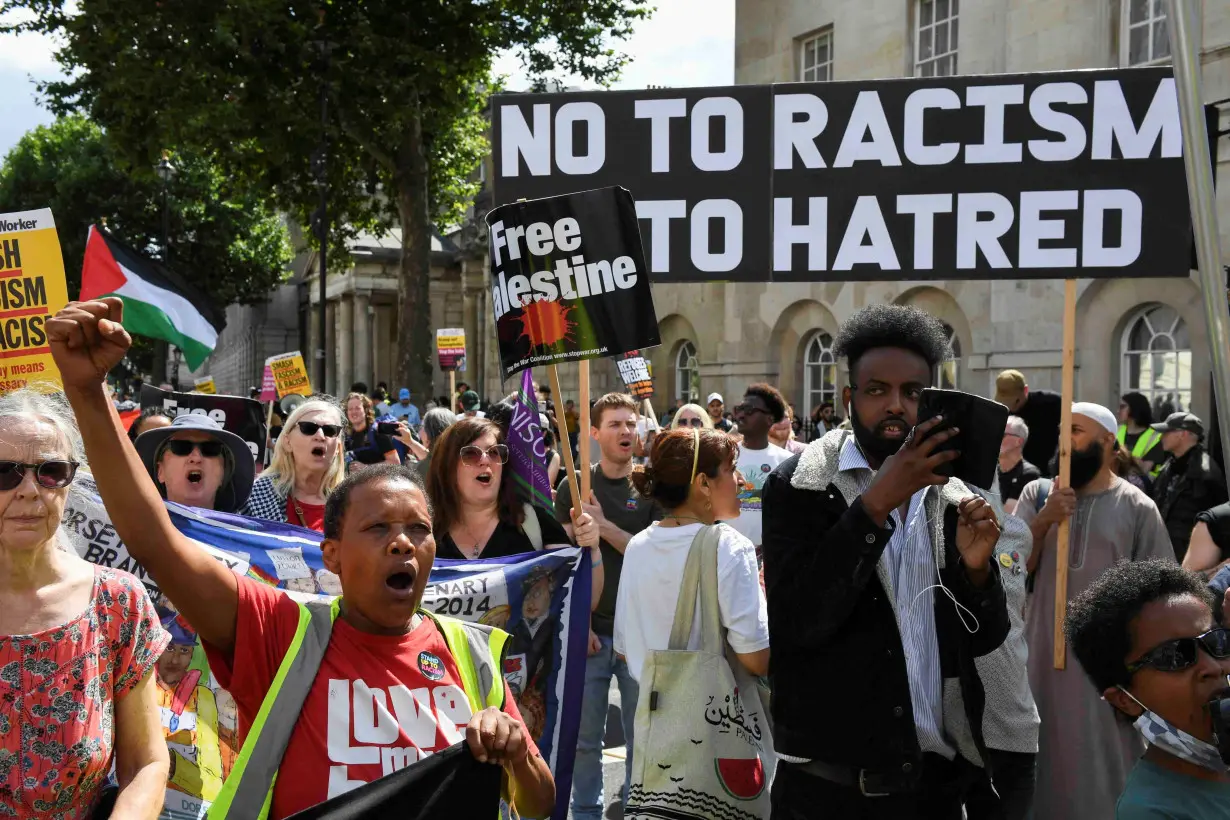 FILE PHOTO: Counter-protesters against Tommy Robinson attend a march organised by Stand Up To Racism and other groups, in London