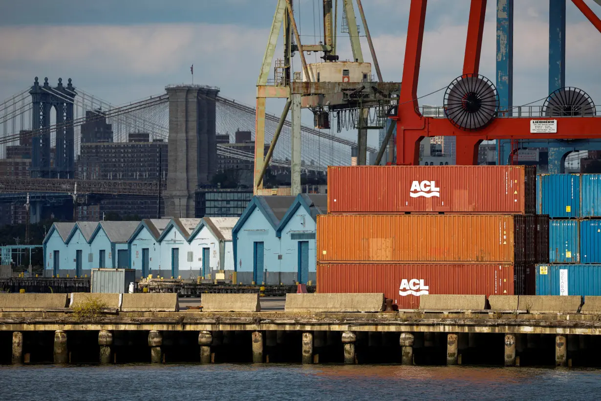 FILE PHOTO: Shipping containers are stacked on a pier at the Red Hook Terminal in Brooklyn, New York