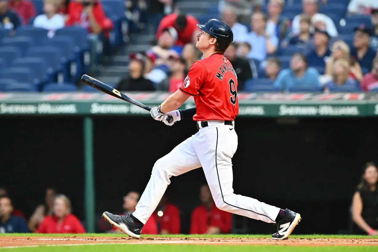 Guardians first baseman Kyle Manzardo hits a solo home run against the Reds.