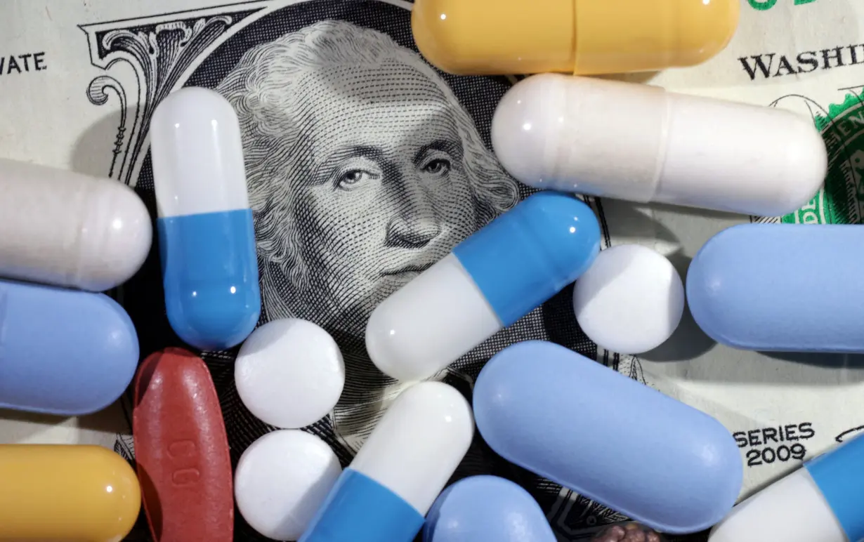 Illustration shows U.S. dollar banknote and medicines