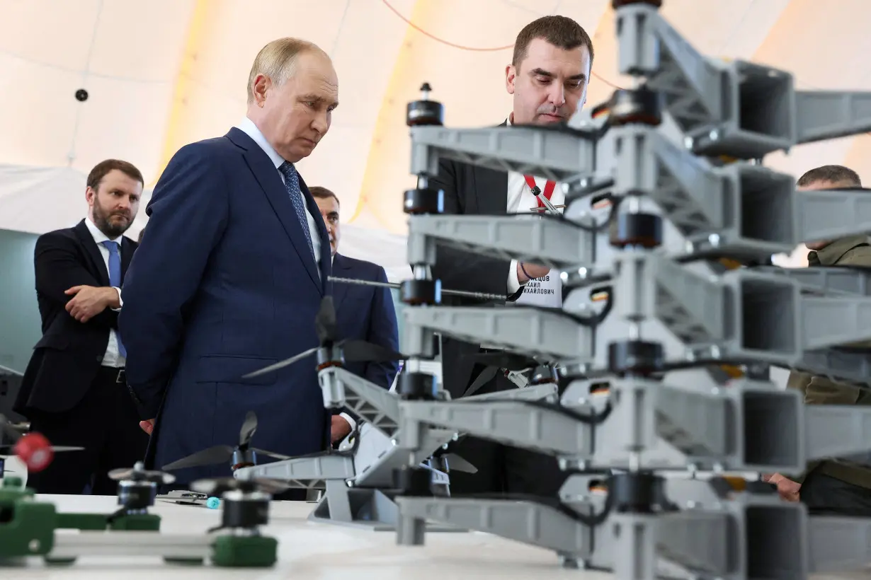 FILE PHOTO: Russia's President Vladimir Putin visits a drone production facility in Saint Petersburg