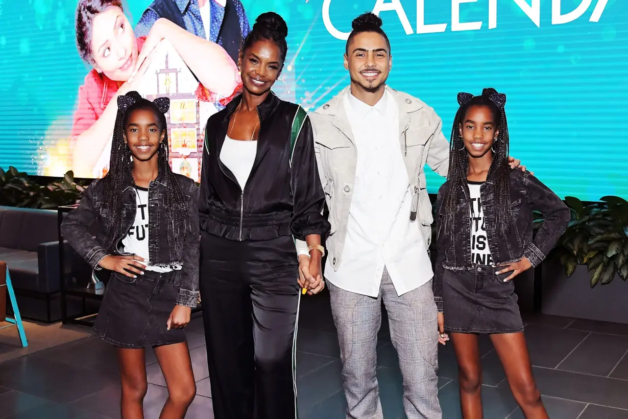 Kim Porter (second from left), Quincy Brown (second from right), D'Lila Star Combs, and Jessie James Combs are pictured in 2018.