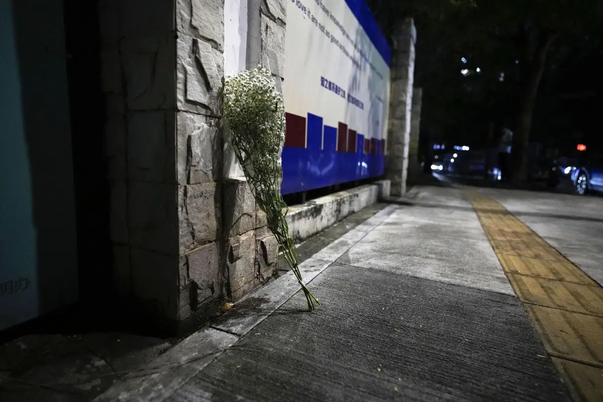 While flowers are placed at the location where the boy was fatally stabbed.