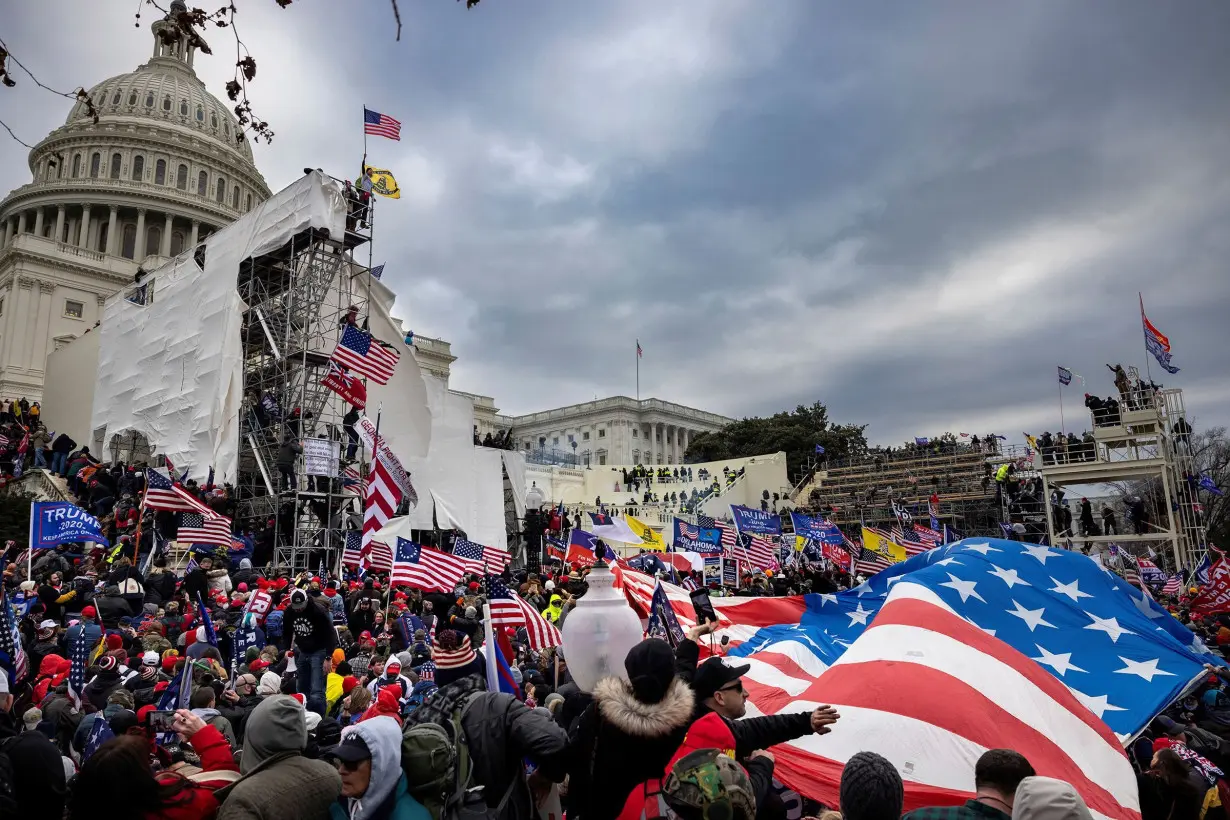 Justice Department watchdog says report on agency's handling of January 6 riot likely won't be released until after election