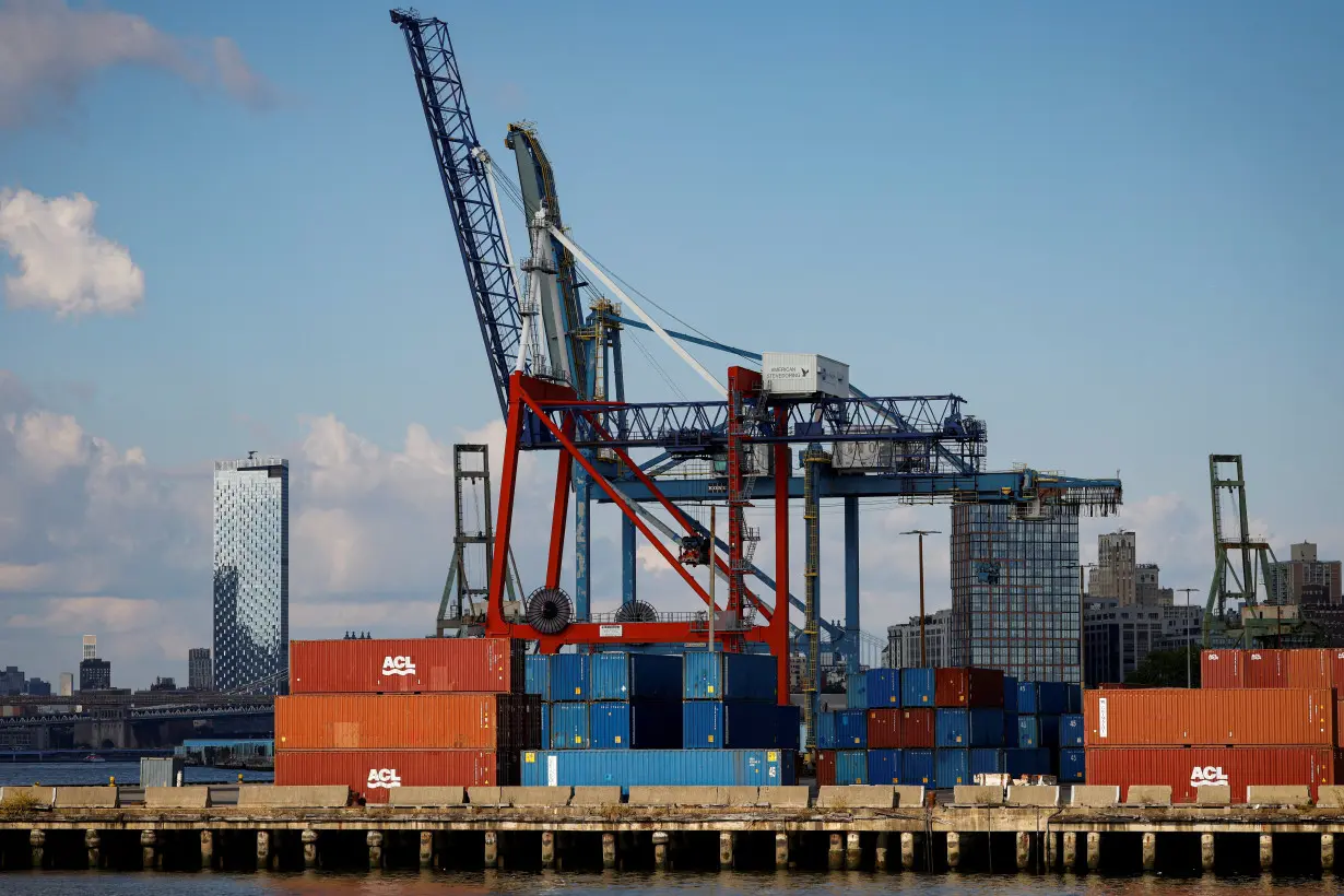 Shipping containers are stacked on a pier at the Red Hook Terminal in Brooklyn, New York