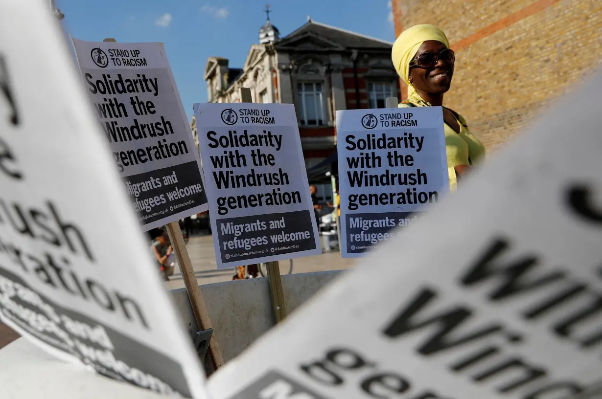 FILE PHOTO: A woman attends an event in Windrush Square to show solidarity with the Windrush generation in the Brixton district of London