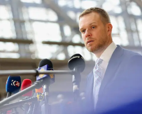 Lithuania's foreign minister calls for Ukraine to be allowed to use arms freely