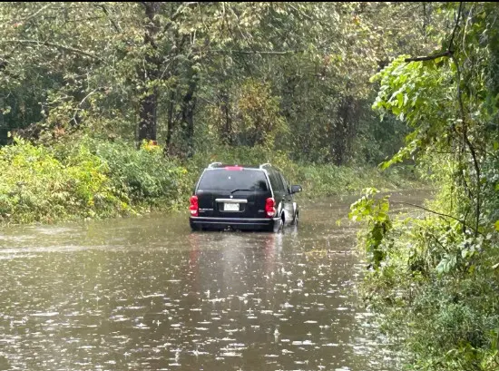 Family rescues driver from floodwaters as Helene hits