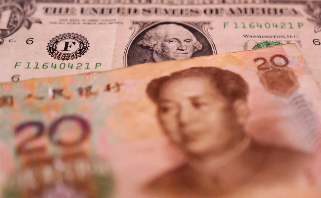 FILE PHOTO: FILE PHOTO: Illustration shows U.S. dollar and Chinese Yuan banknotes