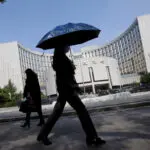 China cuts banks' reserve ratio as economic growth sputters