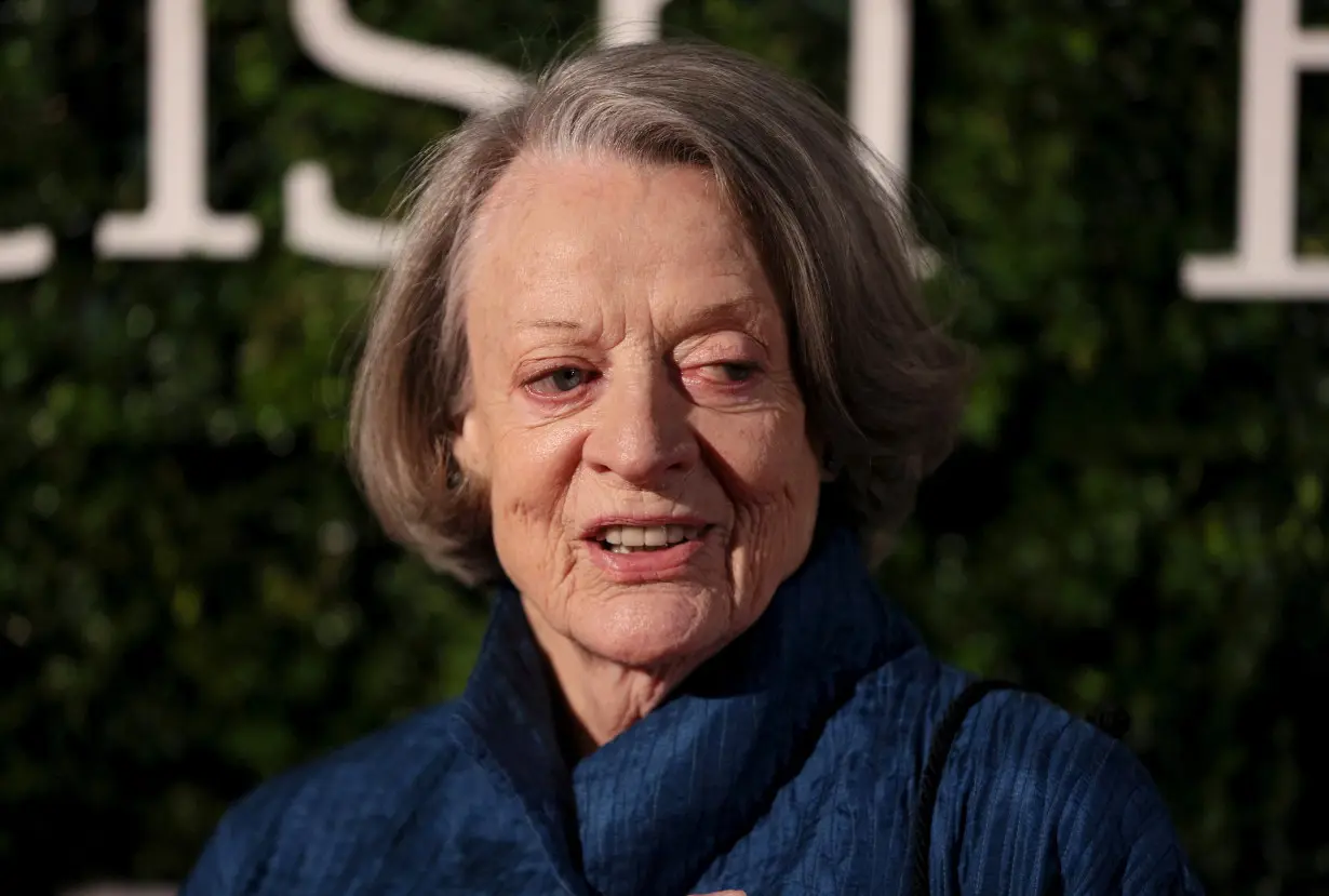 FILE PHOTO: British actress Maggie Smith poses for photographers at the Evening Standard British Film Awards in London, Britain