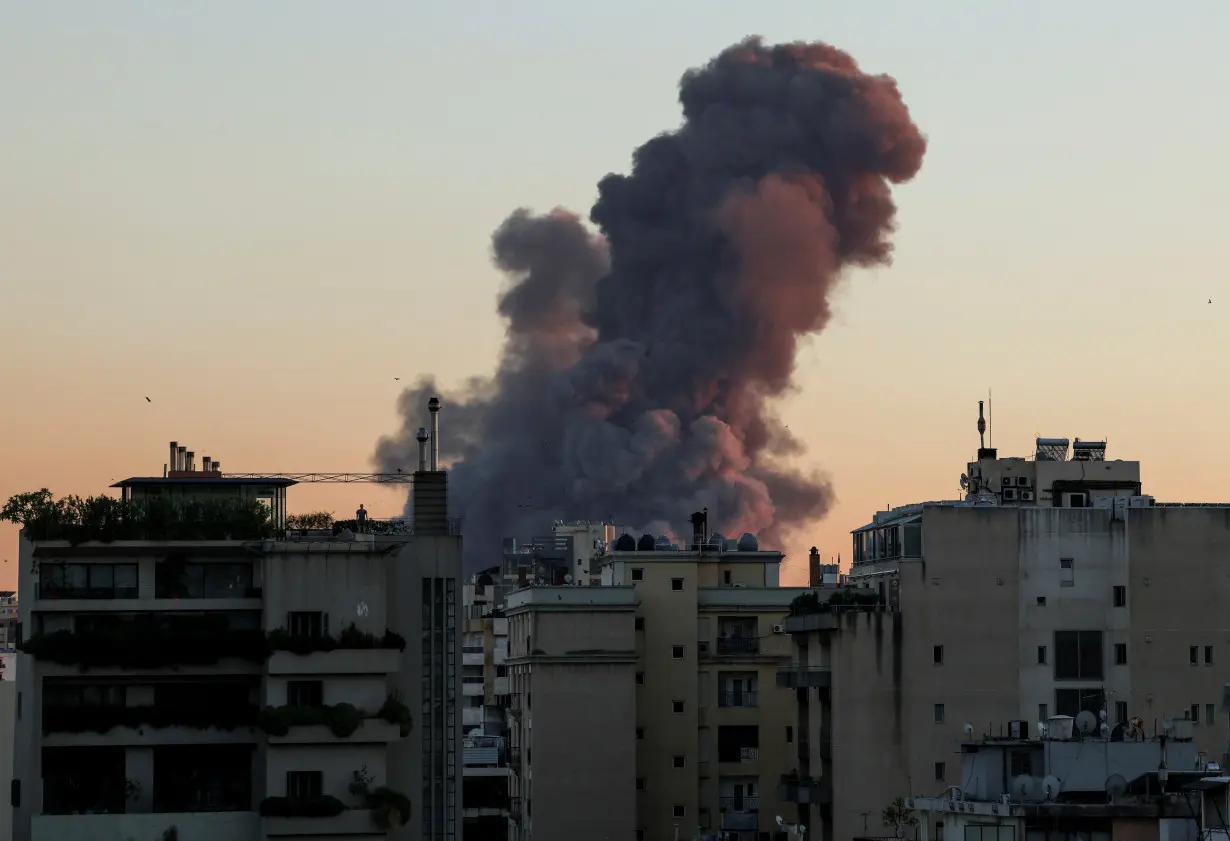 Smoke rises after explosions in Beirut