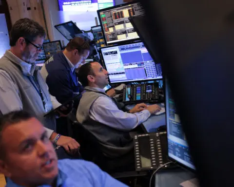 Yields, dollar dip, Dow hits record after US inflation data