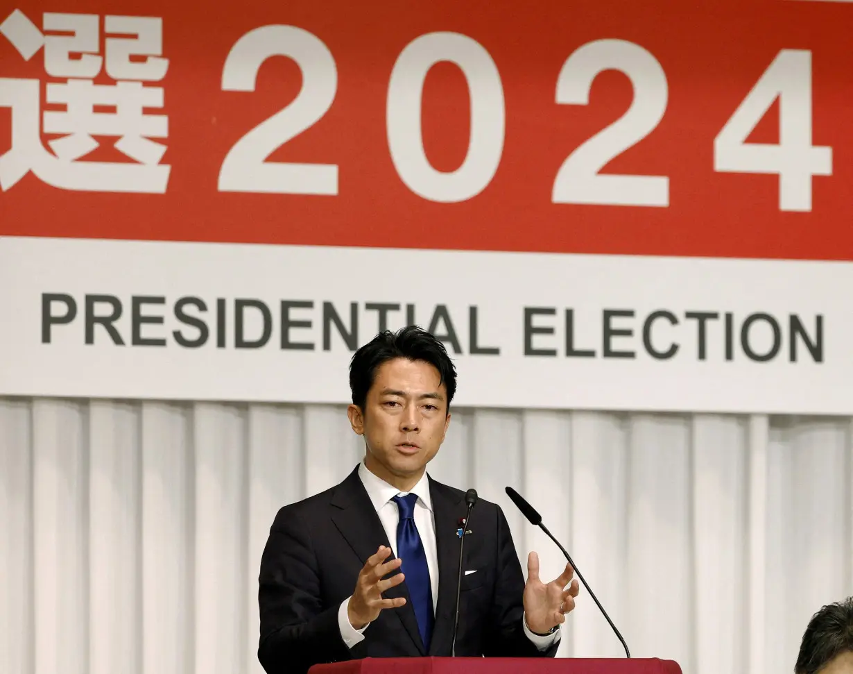 FILE PHOTO: Japanese former Environment Minister Shinjiro Koizumi speaks in Tokyo