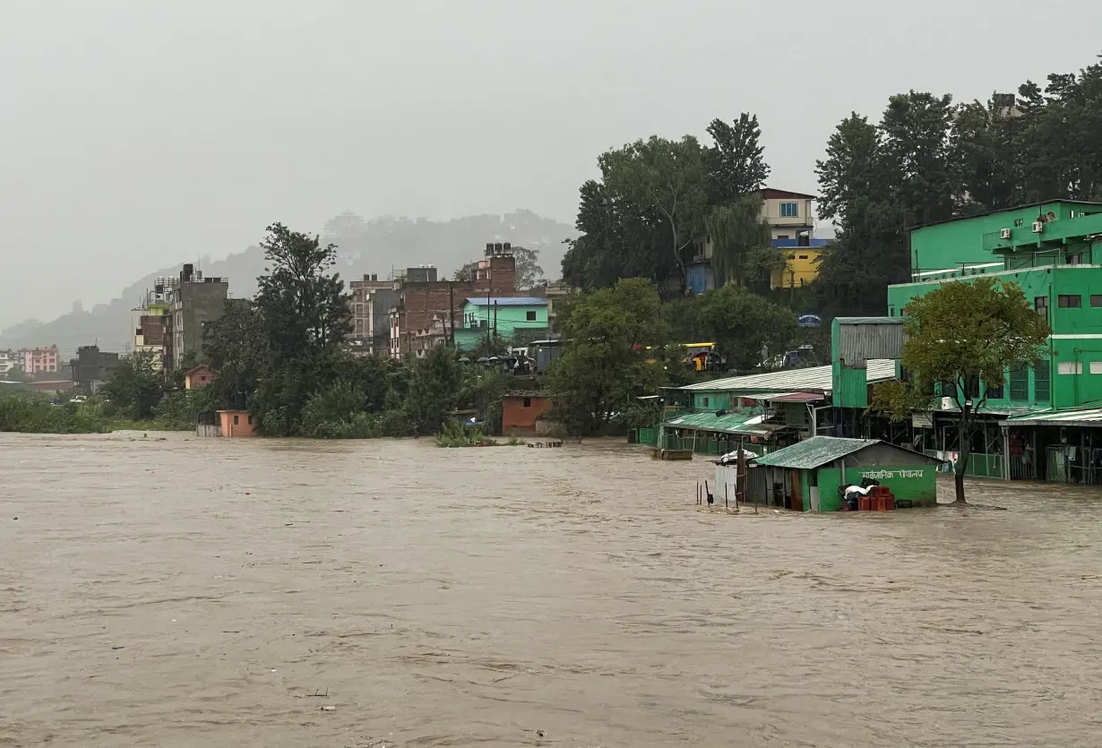 Flood along the bank of overflowing Bagmati River following heavy rains in Kathmandu