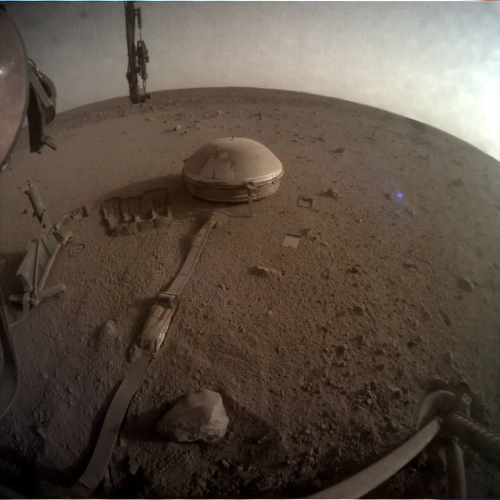 FILE PHOTO: View of the InSight's seismometer on the Martian surface, in one of the last images taken by NASA's InSight Mars lander