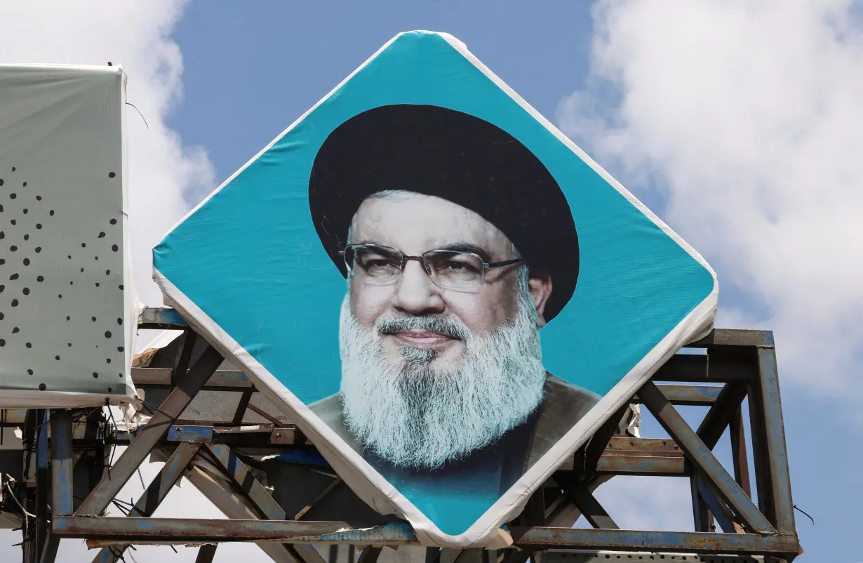 A sign depicting Lebanon's Hezbollah leader Sayyed Hassan Nasrallah is placed in the southern Lebanese port city of Tyre