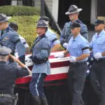 Massachusetts police gather at funeral for trooper recruit who died during training