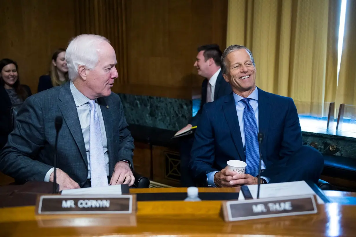 Sens. John Cornyn, a Texas Republican, and John Thune, a Republican from South Dakota, are seen before a Senate Finance Committee hearing in Washington in 2019.