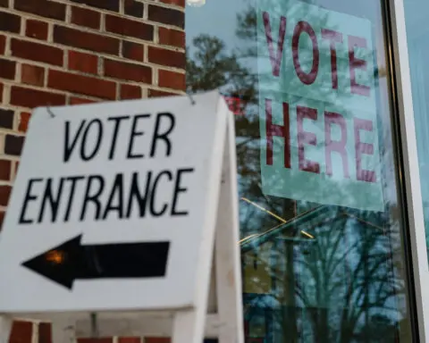 Justice Department sues Alabama over its effort to remove more than 3,000 names from voter rolls too close to election