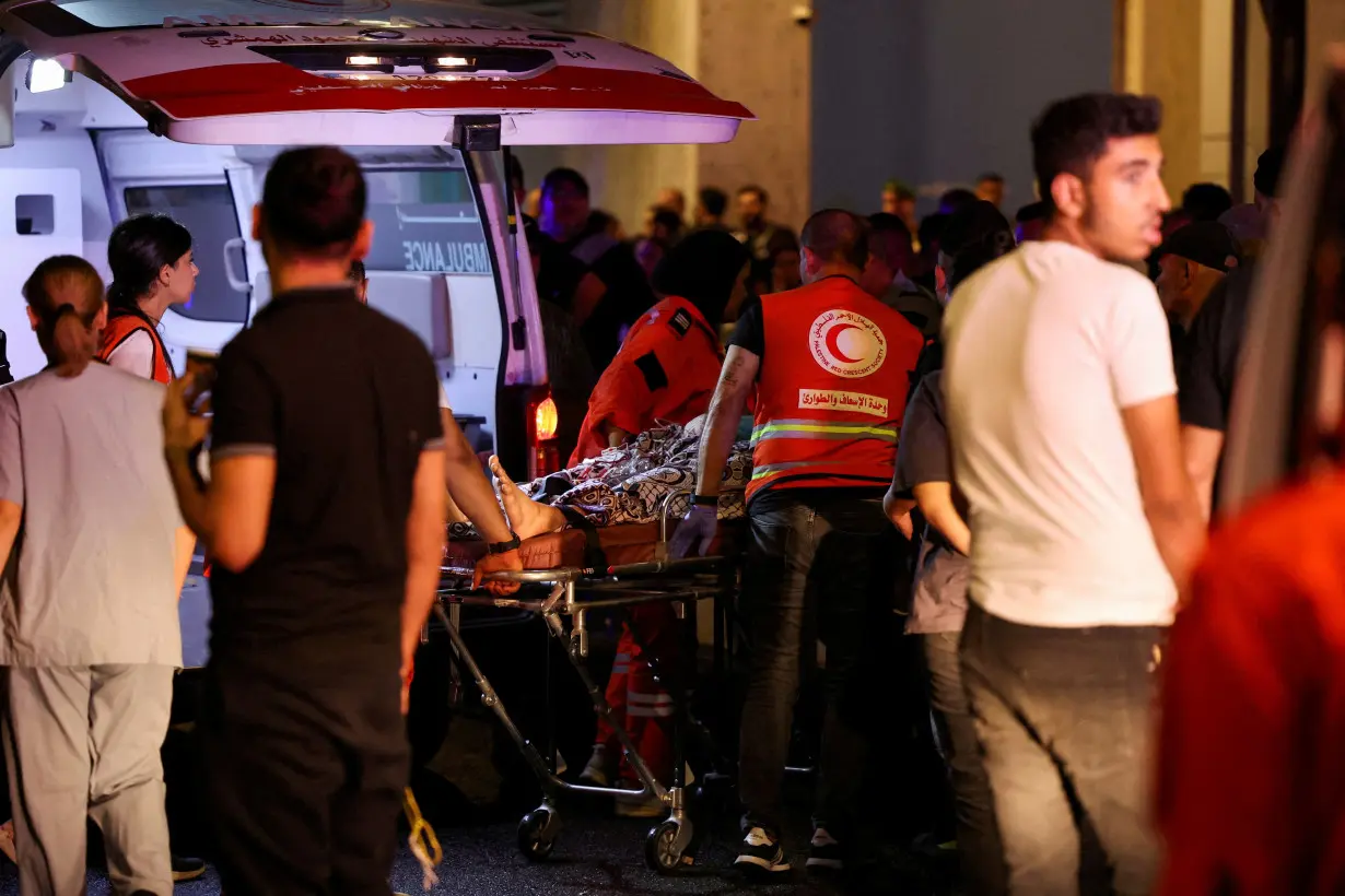 FILE PHOTO: A person is carried outside American University of Beirut Medical Center, including Hezbollah fighters and medics, were wounded and killed when the pagers they use to communicate exploded across Lebanon, according to a security source, in Beiru