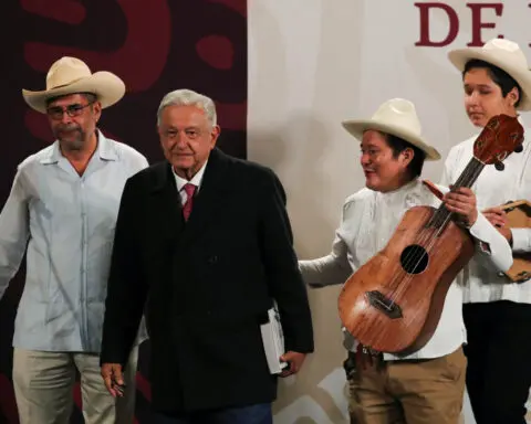 Mexico's Lopez Obrador raffles his watch in colorful final press conference