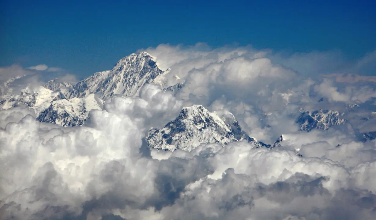 FILE PHOTO: Mount Everest (top), highest peak in the world, is seen in this aerial view