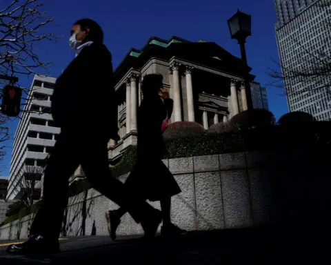 BOJ signals rate-hike pause after big Fed cut, market rout