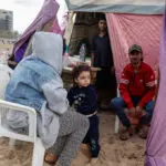 As Israeli jets hit Beirut, people flee to sleep on the beach