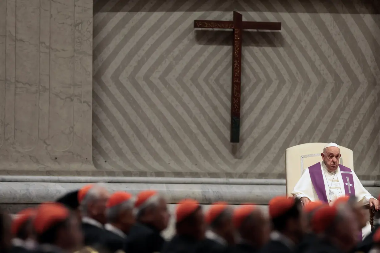 Pope Francis presides over a vigil ahead of the Synod of bishops, at the Vatican