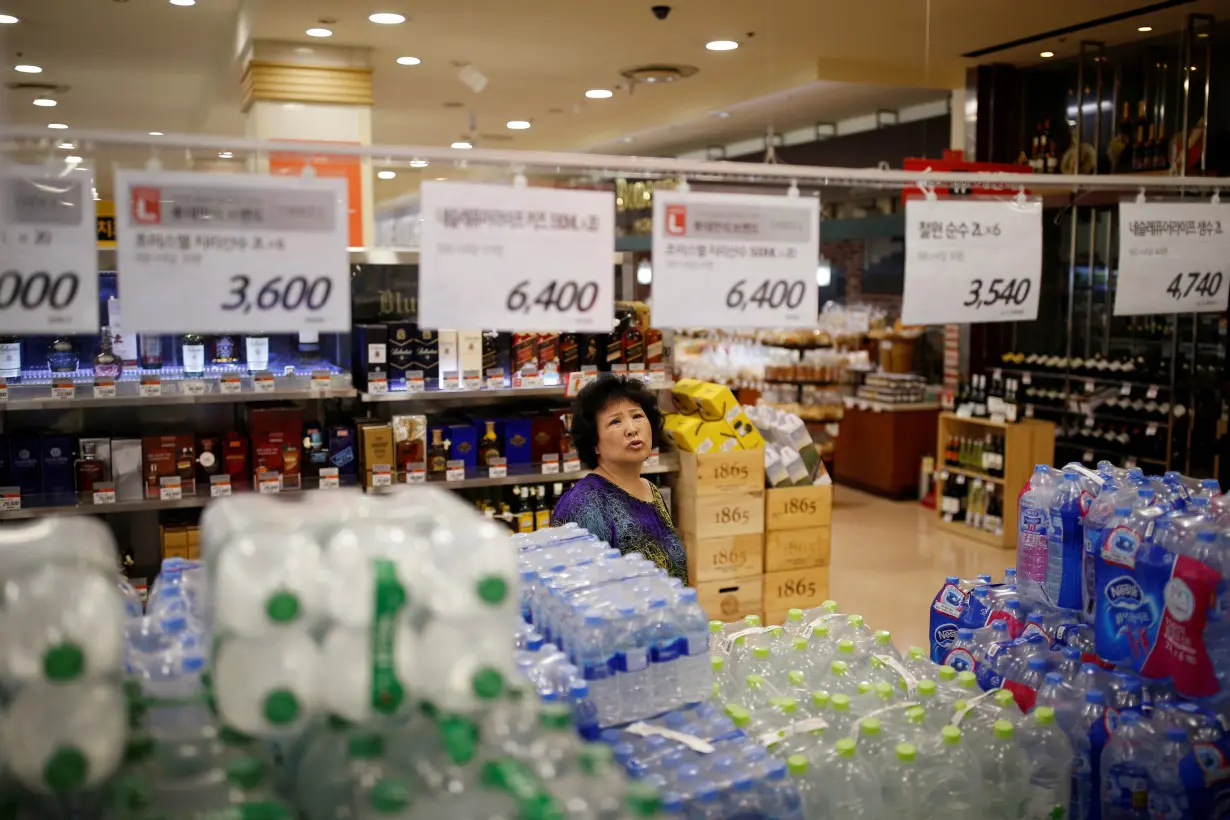 A woman shops at a market in Seoul