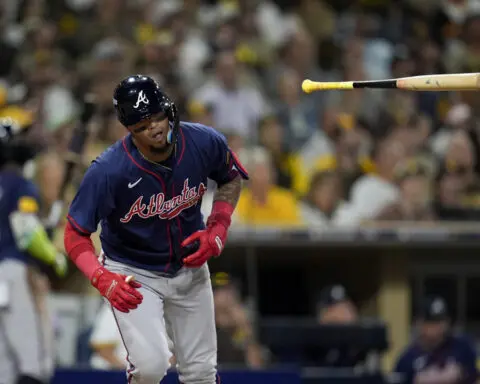 Tatis hits 2-run homer, King strikes out 12 as the Padres beat the Braves 4-0 in playoff opener