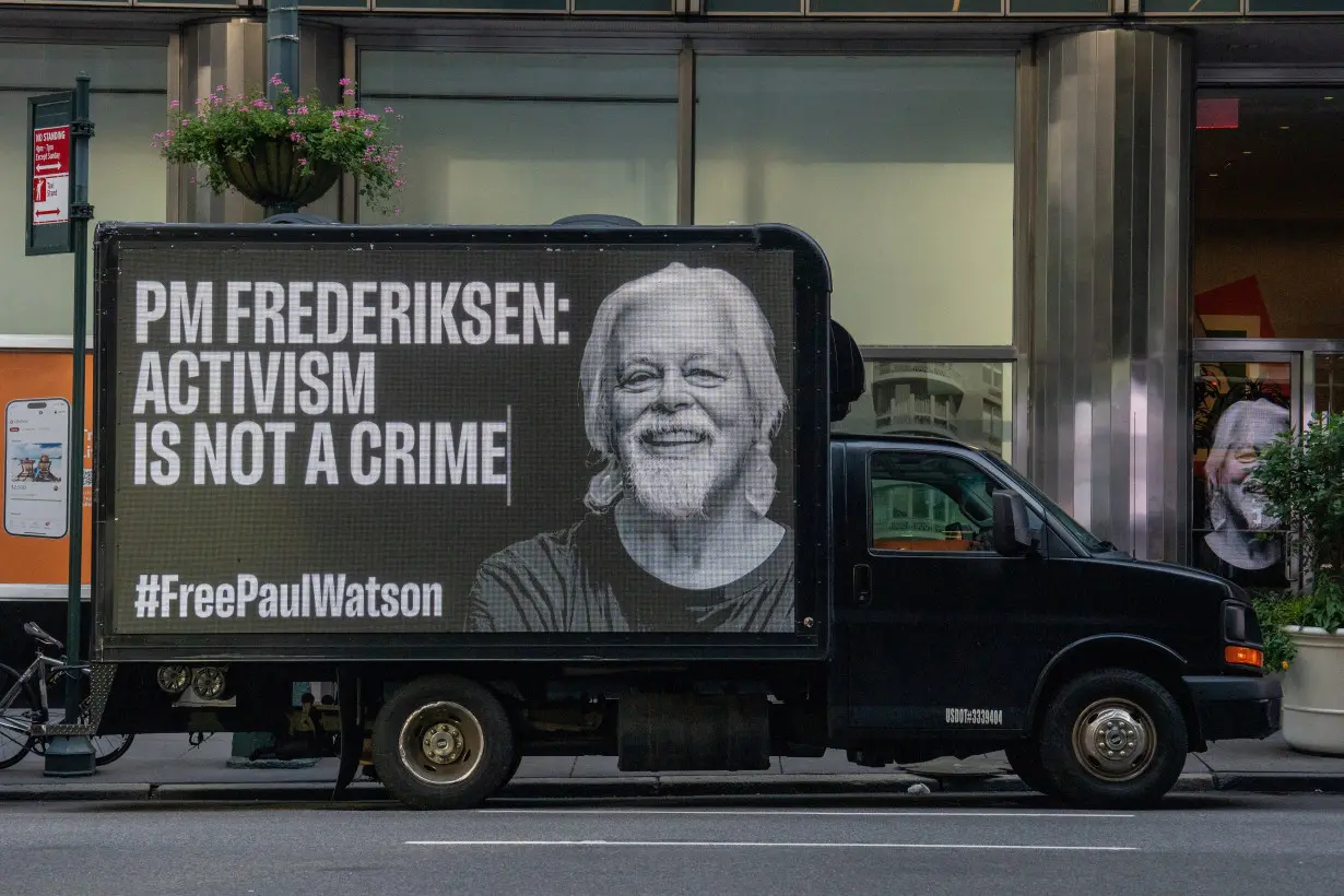 Trucks with digital billboards displaying a photo of Paul Watson and calling for his release