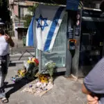 Israelis hold vigil at Tel Aviv train stop after Palestinian shooting attack