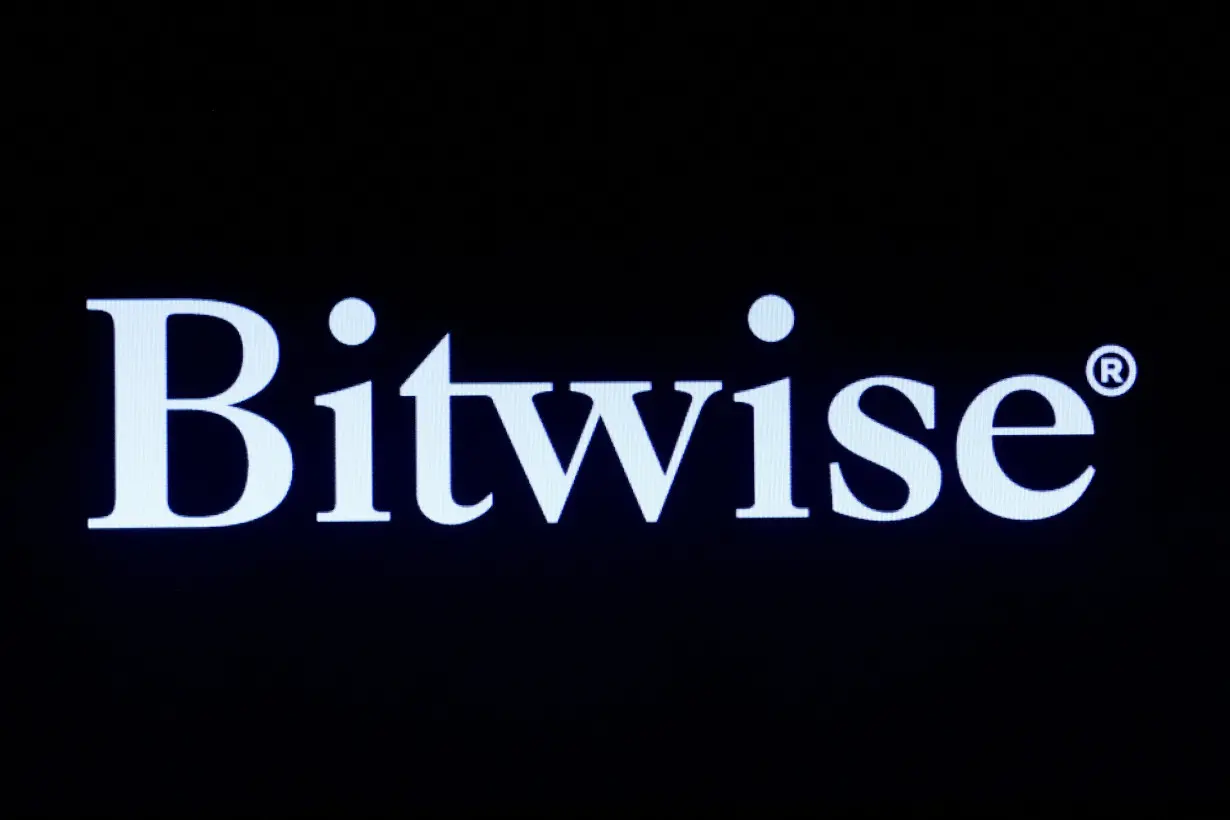 The company logo for Bitwise Asset Management is displayed on a screen on the floor of the NYSE in New York