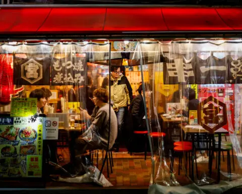 Japan's service sector expands for third month, but confidence dips, PMI shows