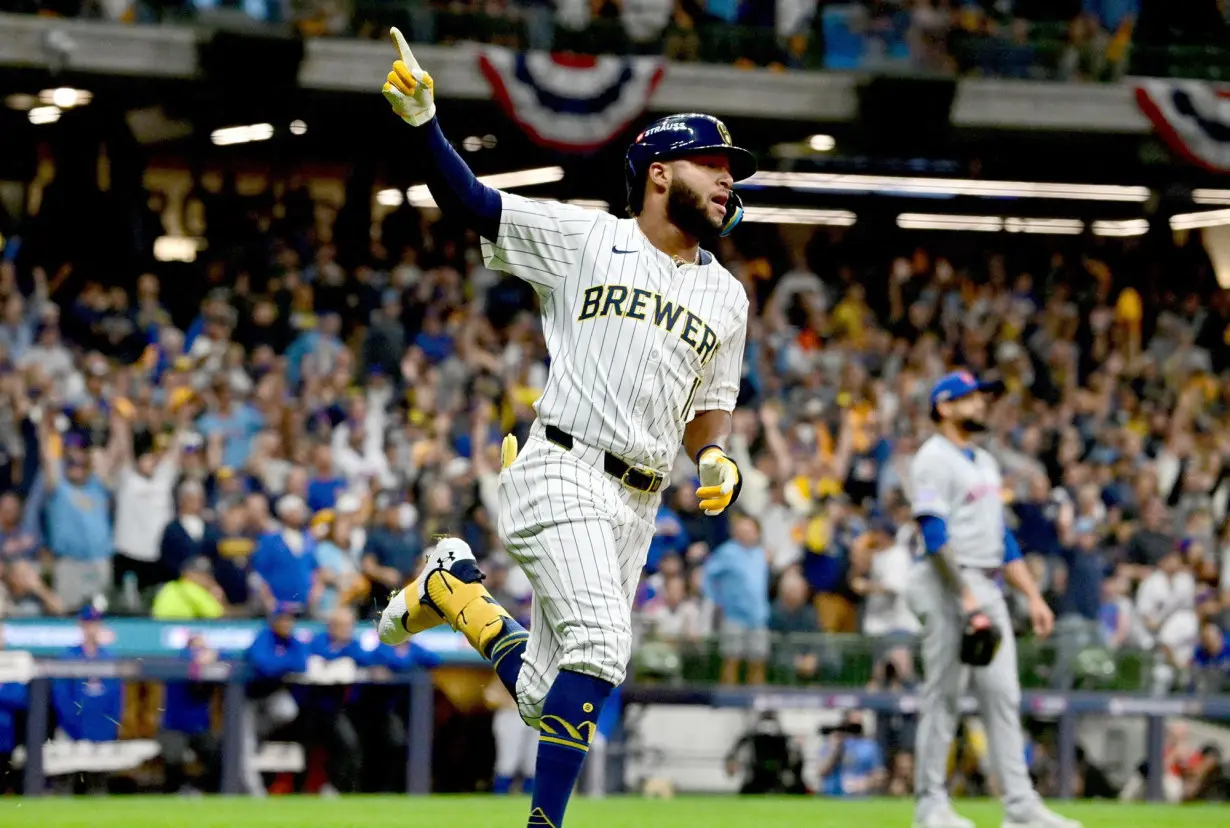 Jackson Chourio reacts after hitting a home run during the first inning.