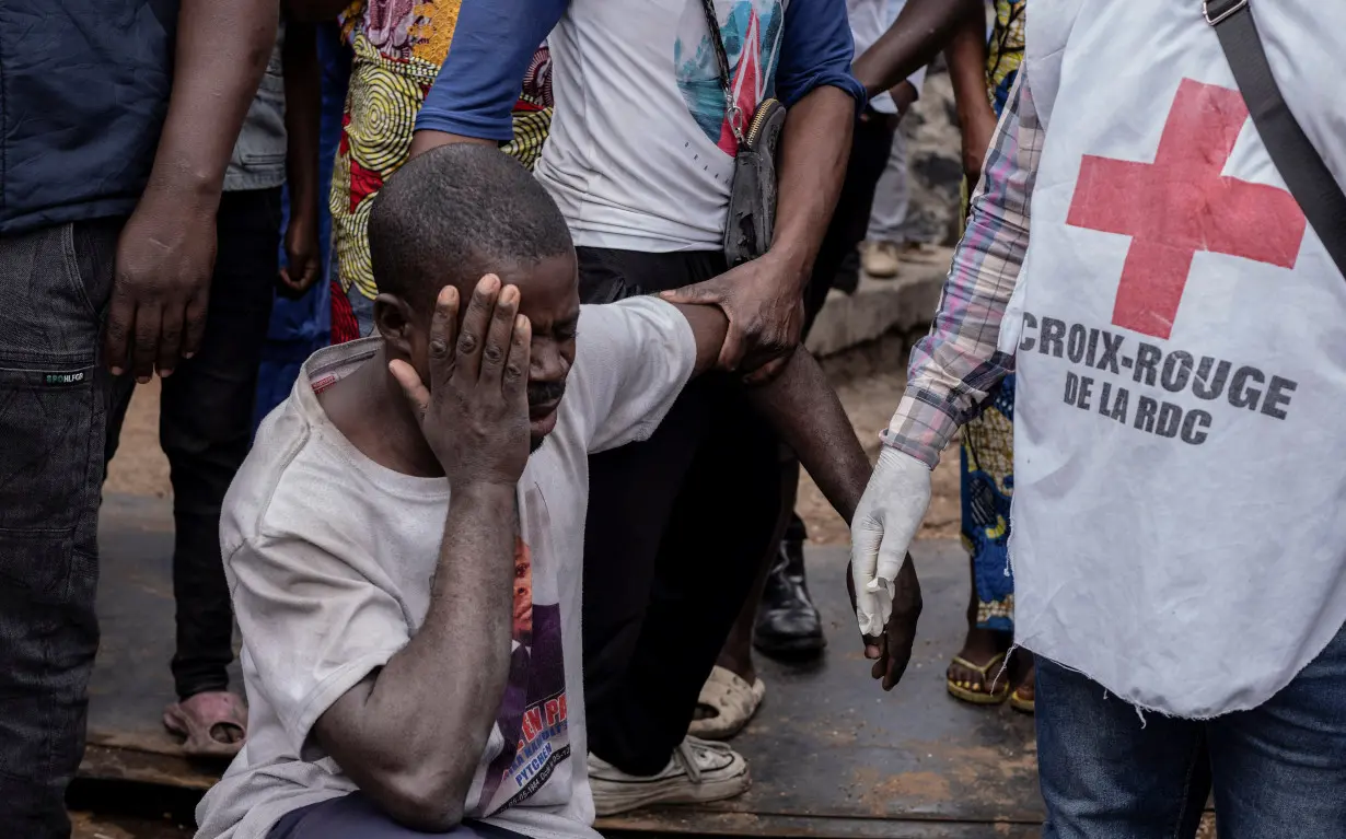 A man reacts after his family member died after a boat ferrying passengers and goods from the Minova villages sank in Lake Kivu near the Port of Kituku in Goma