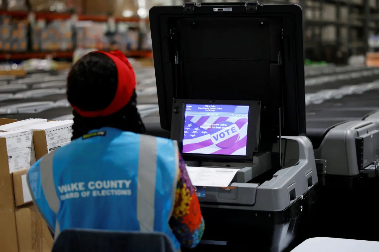 Precinct official tests voting machines in Raleigh