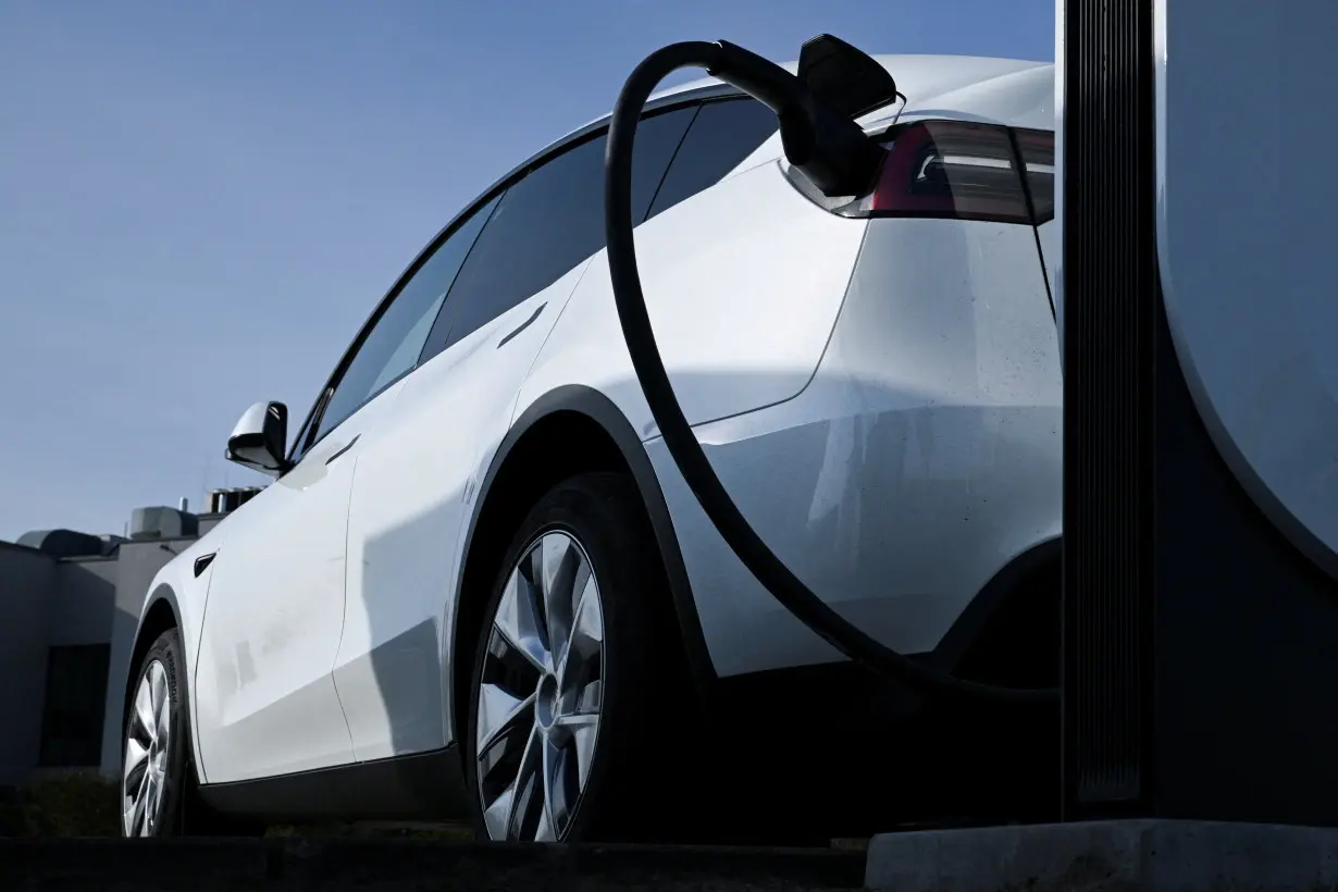 FILE PHOTO: A Tesla electric car charging station near Berlin