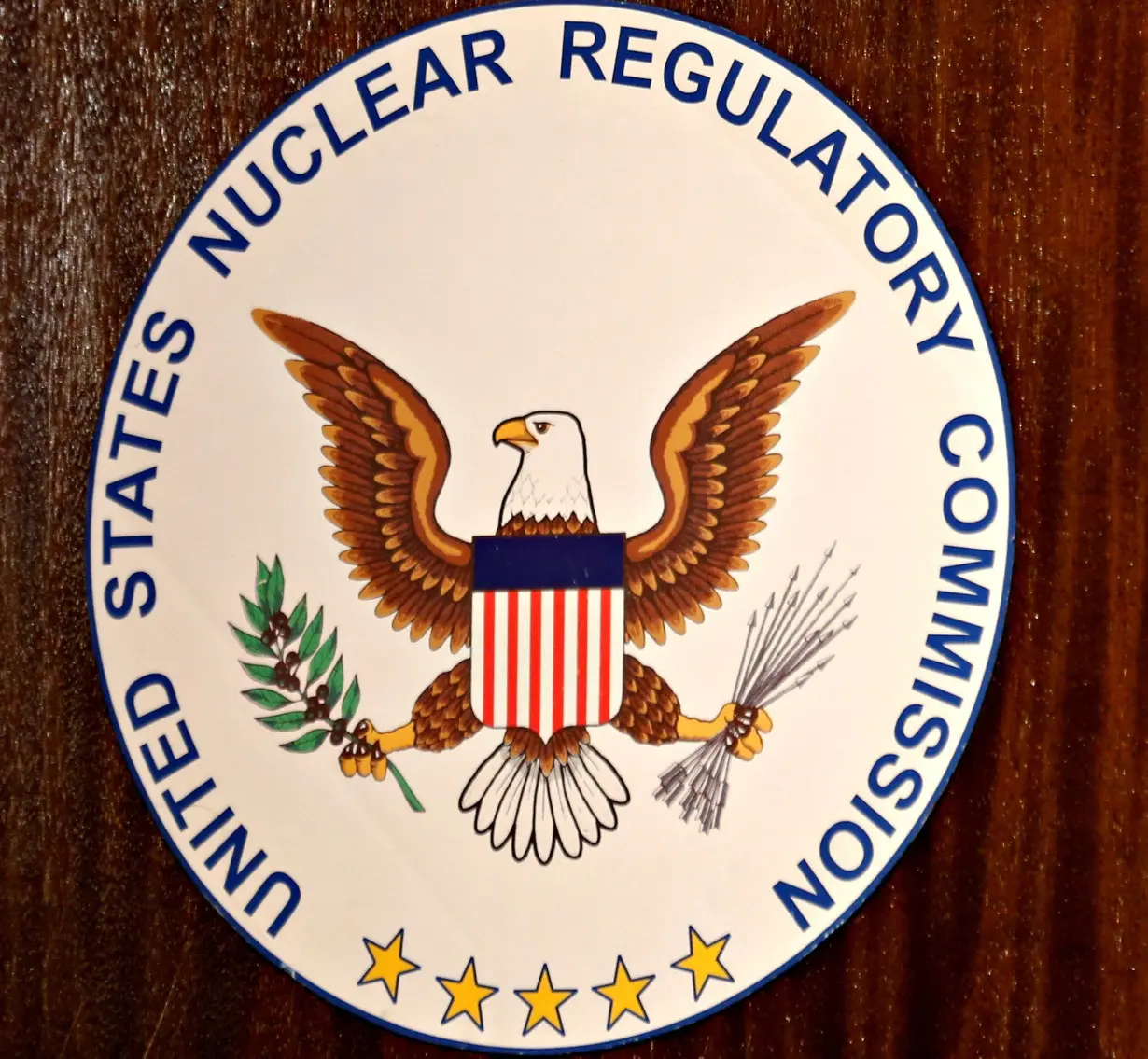 FILE PHOTO: The logo of the U.S. Nuclear Regulatory Commission is shown on the podium at the San Onofre Nuclear Generating Staion in Carlsbad