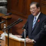 Japan's new leader expresses regret for governing party slush fund scandal, vows stronger defense