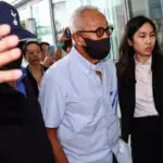 Singapore charges property billionaire linked to jailed minister's case