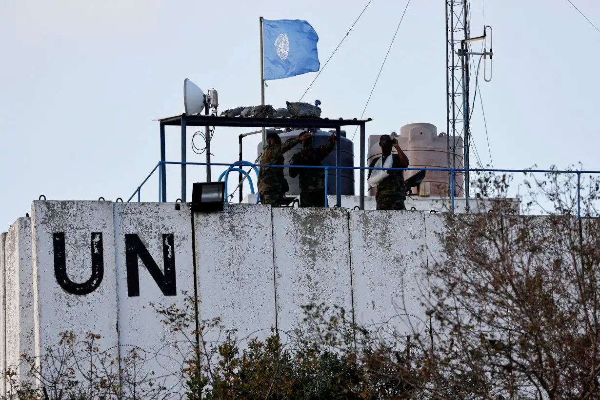 FILE PHOTO: United Nations peacekeepers (UNIFIL) look at the Lebanese-Israeli border